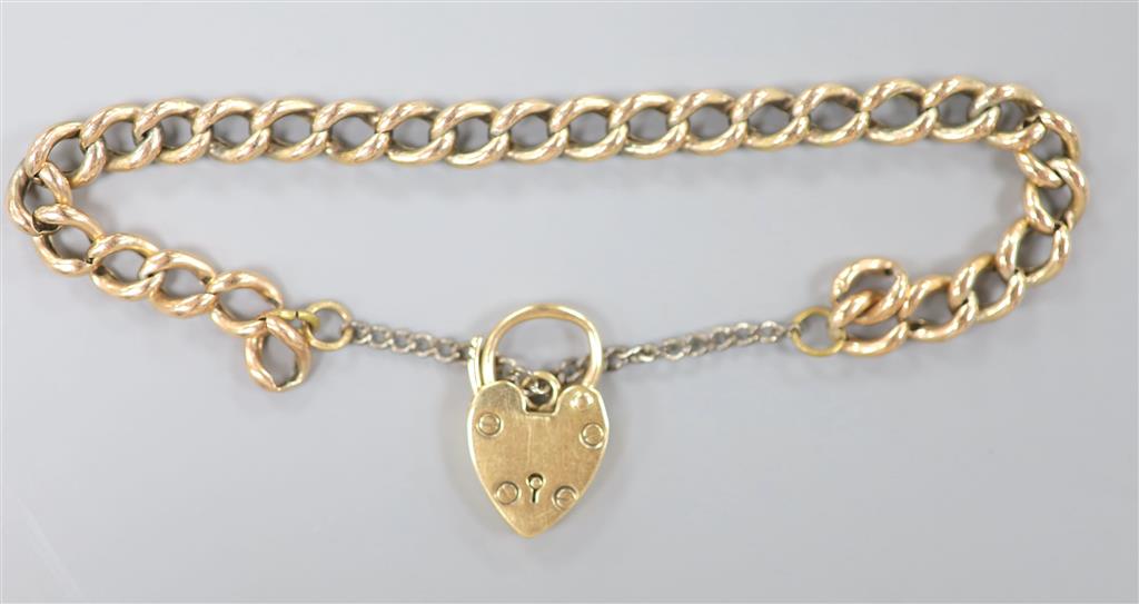 A 9ct gold curblink bracelet, with heart shaped padlock clasp, approx. 17cm, gross 9.5 grams.